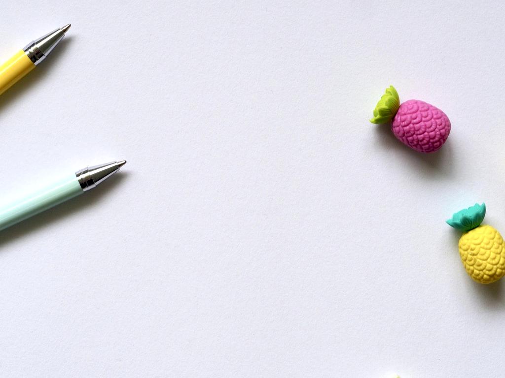 Close-up of a person wiping a desk surface