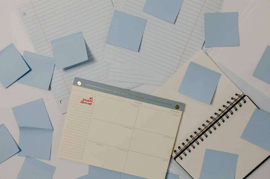 Planner and calendar with a pen marking tasks