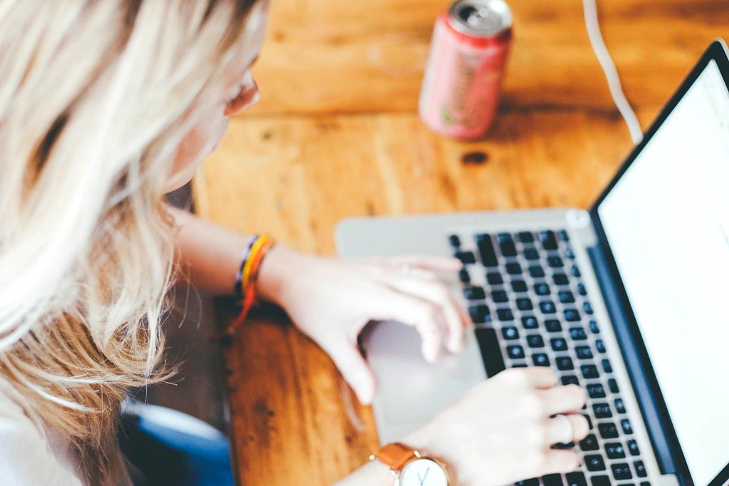 Modern organized workspace with laptop, plants, and productivity tools
